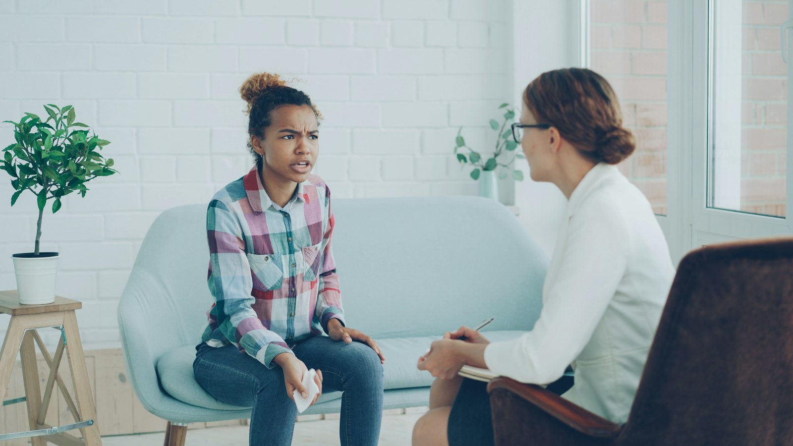 Woman talking with a counselor in an outpatient office