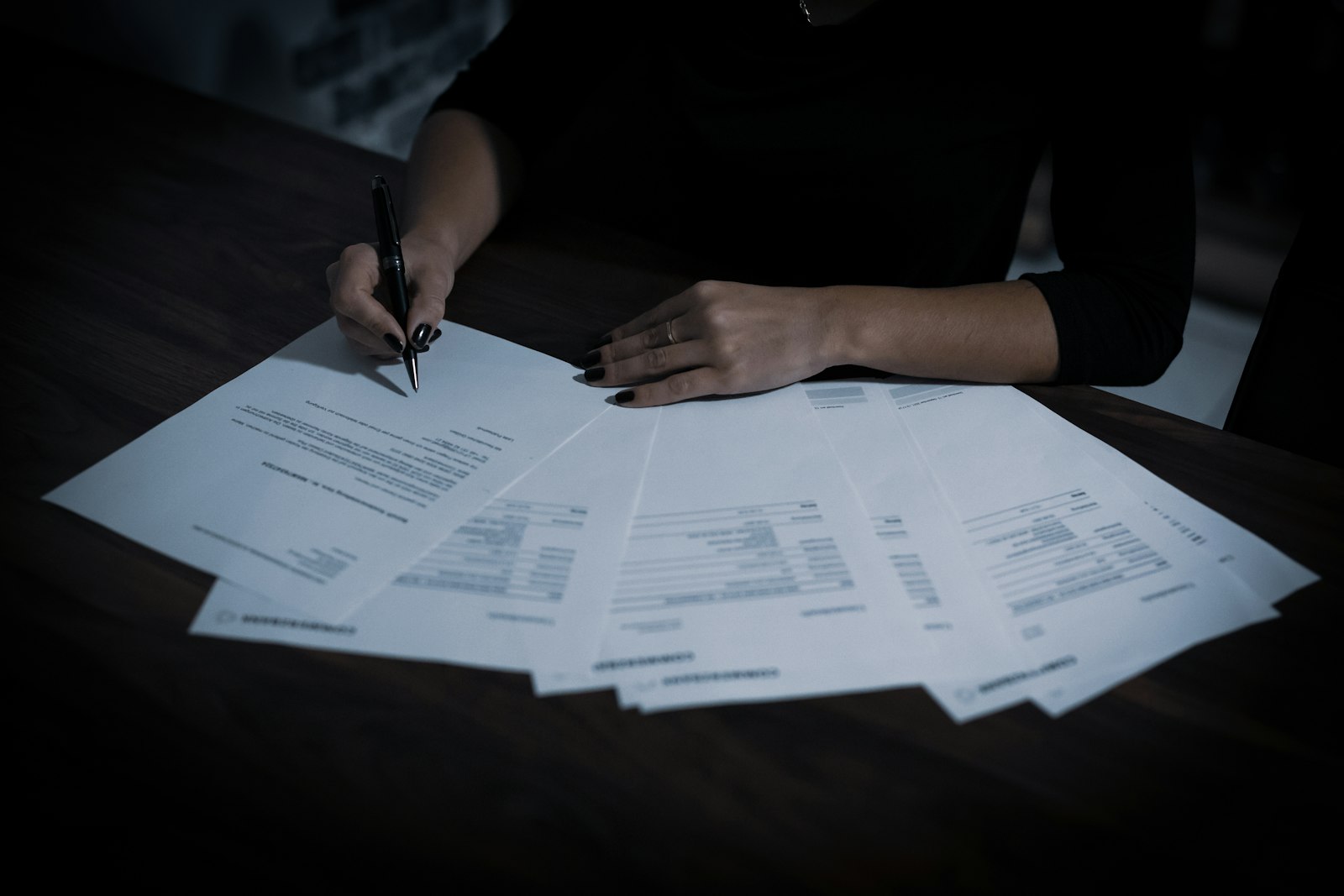 Person reviewing insurance paperwork at a table