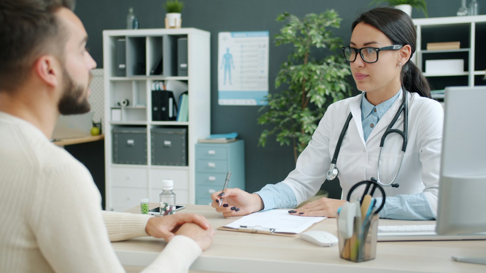 Clinician talking with a patient during an intake visit